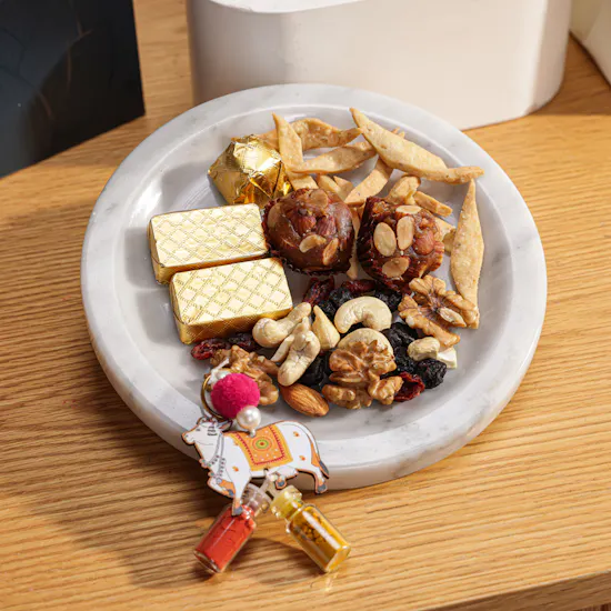 MyGovindas Rakhi Mixed Sweets Hamper | Moments of Adventure Flowers