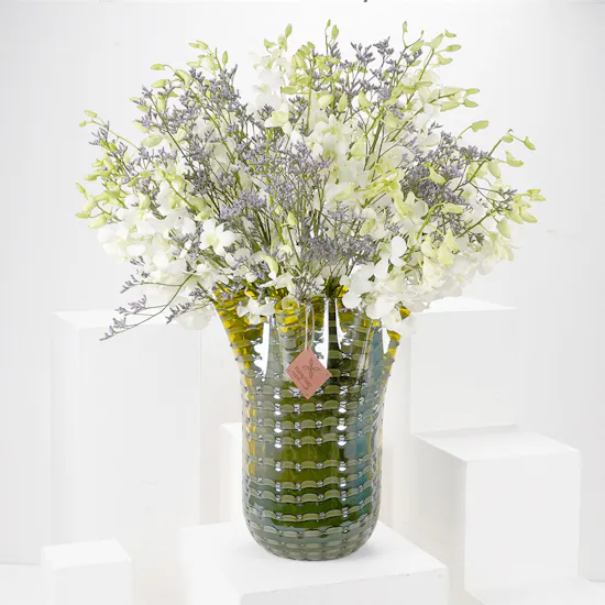 White Baby Orchids and Sea Lavender in a Yellow Vase