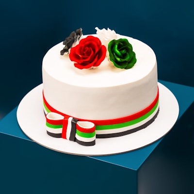 UAE ribbon and flowers cake by Mister Baker