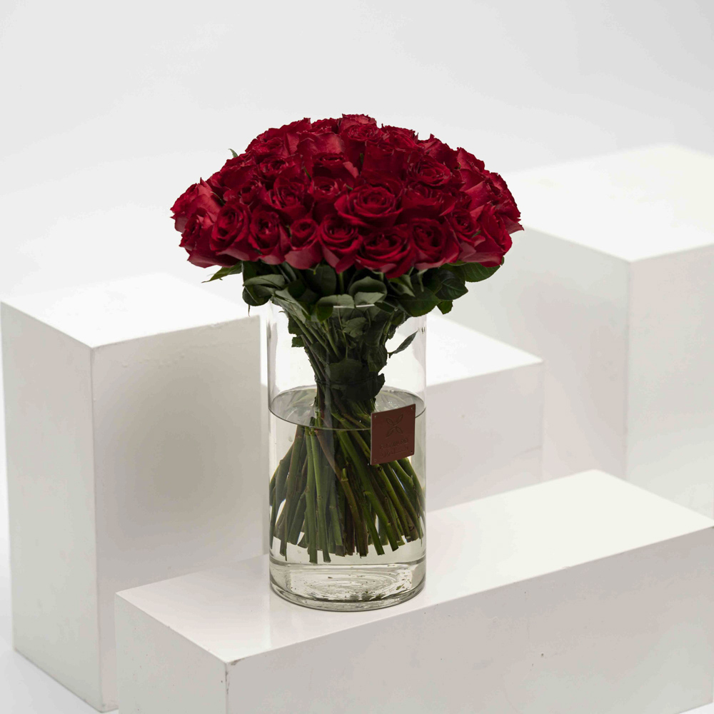 Image of Crimson hydrangea in a vase on a coffee table