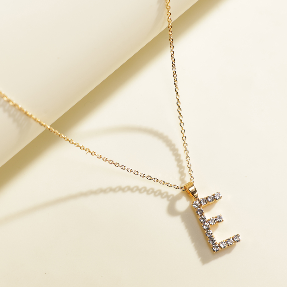 Buy and send Caroline Svedbom Mini E Letter Crystal Necklace gift