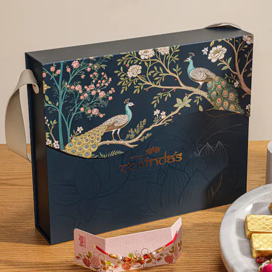 MyGovindas Rakhi Mixed Sweets Hamper | Moments of Adventure Flowers