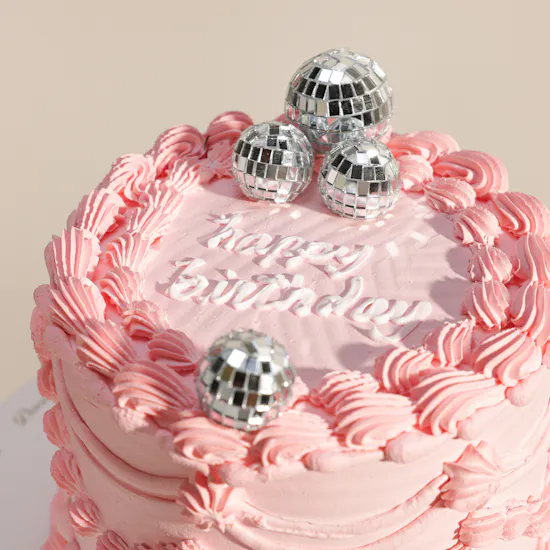 December Cake Pink Birthday Cake with Disco Balls | Delicate Flowers Bouquet