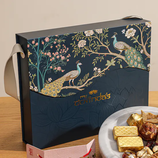 MyGovindas Rakhi Mixed Sweets Hamper | Acqua Dell'Elba Blu Gift Set for Men