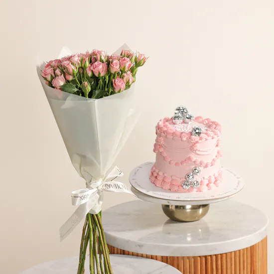 December Cake Pink Birthday Cake with Disco Balls | Delicate Flowers Bouquet