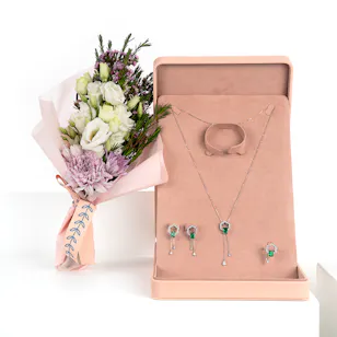 The green  moving jewel kit designed by Floward with a hand bouquet