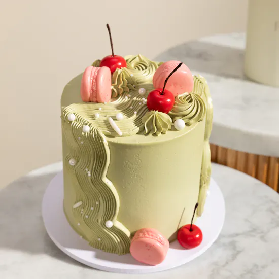 Floward Striking Omani Women's Day Green Cake and Balloon | Petals of Grace