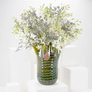 White Baby Orchids and Sea Lavender in a Yellow Vase