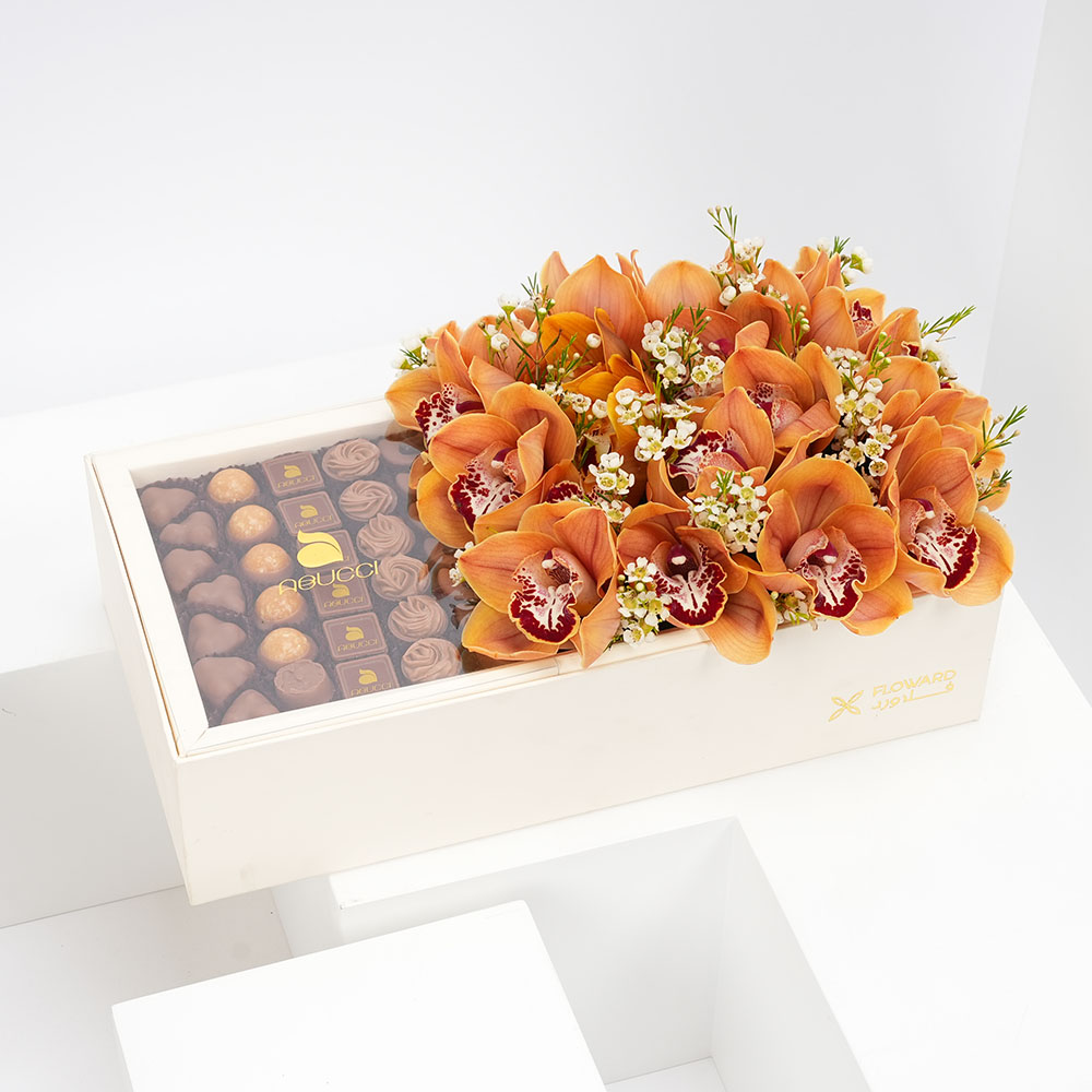 ابوتشي شوكولاتة مع زهورأوركيد برتقالي 