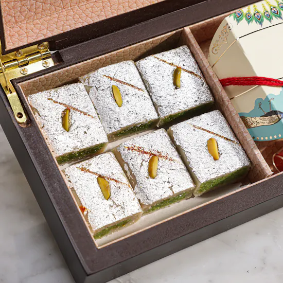 MyGovindas Rakhi Small Assorted Sweets Wooden Hamper | Rooted in Love Plant