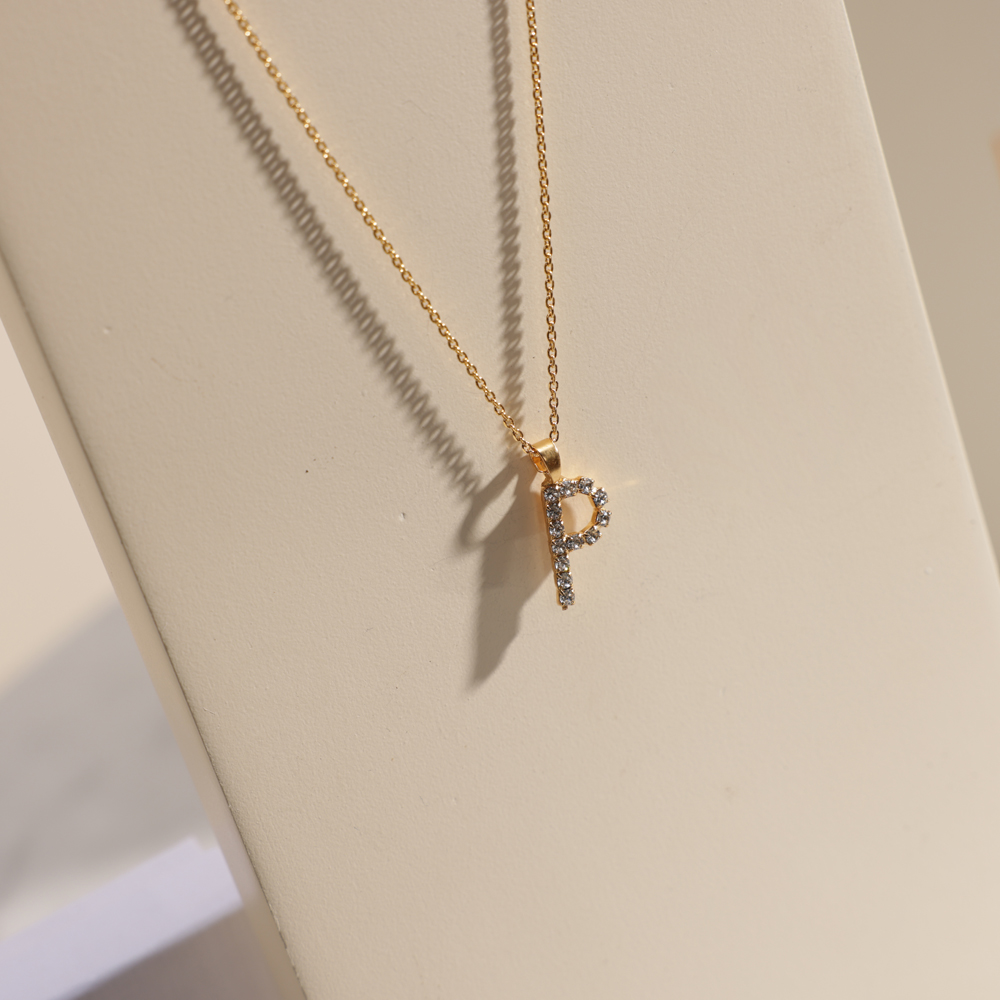 Buy and send Caroline Svedbom Mini P Letter Crystal Necklace