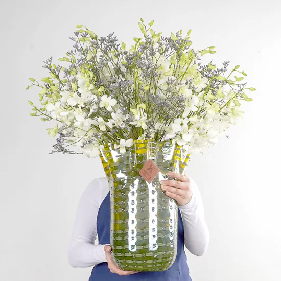 White Baby Orchids and Sea Lavender in a Yellow Vase