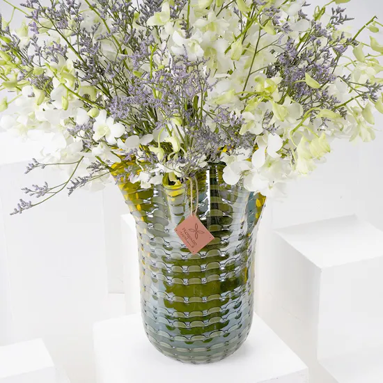 White Baby Orchids and Sea Lavender in a Yellow Vase