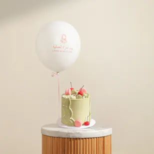 Floward Striking Omani Women's Day Green Cake and Balloon Floward Striking Omani Women's Day Green Cake and Balloon