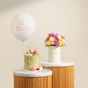 Floward Striking Omani Women's Day Green Cake and Balloon | Petals of Grace Floward Striking Omani Women's Day Green Cake and Balloon | Petals of Grace