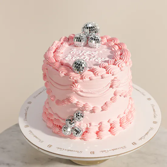 December Cake Pink Birthday Cake with Disco Balls | Delicate Flowers Bouquet